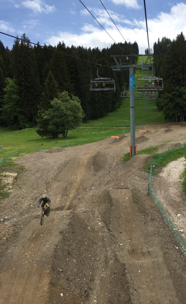 Photo of somebody getting some air from the chair Bike Park Les Gets